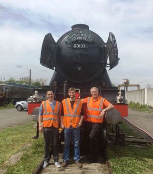 Steam Dreams Head of Service, Operations Director and Chef Director pictured with Flying Scotsman